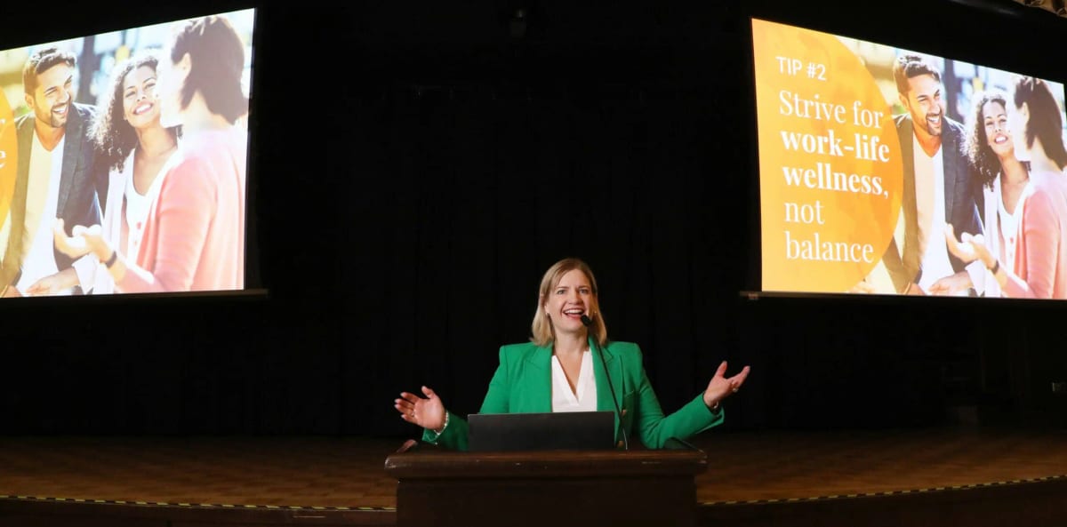 A keynote speaker presenting on stage